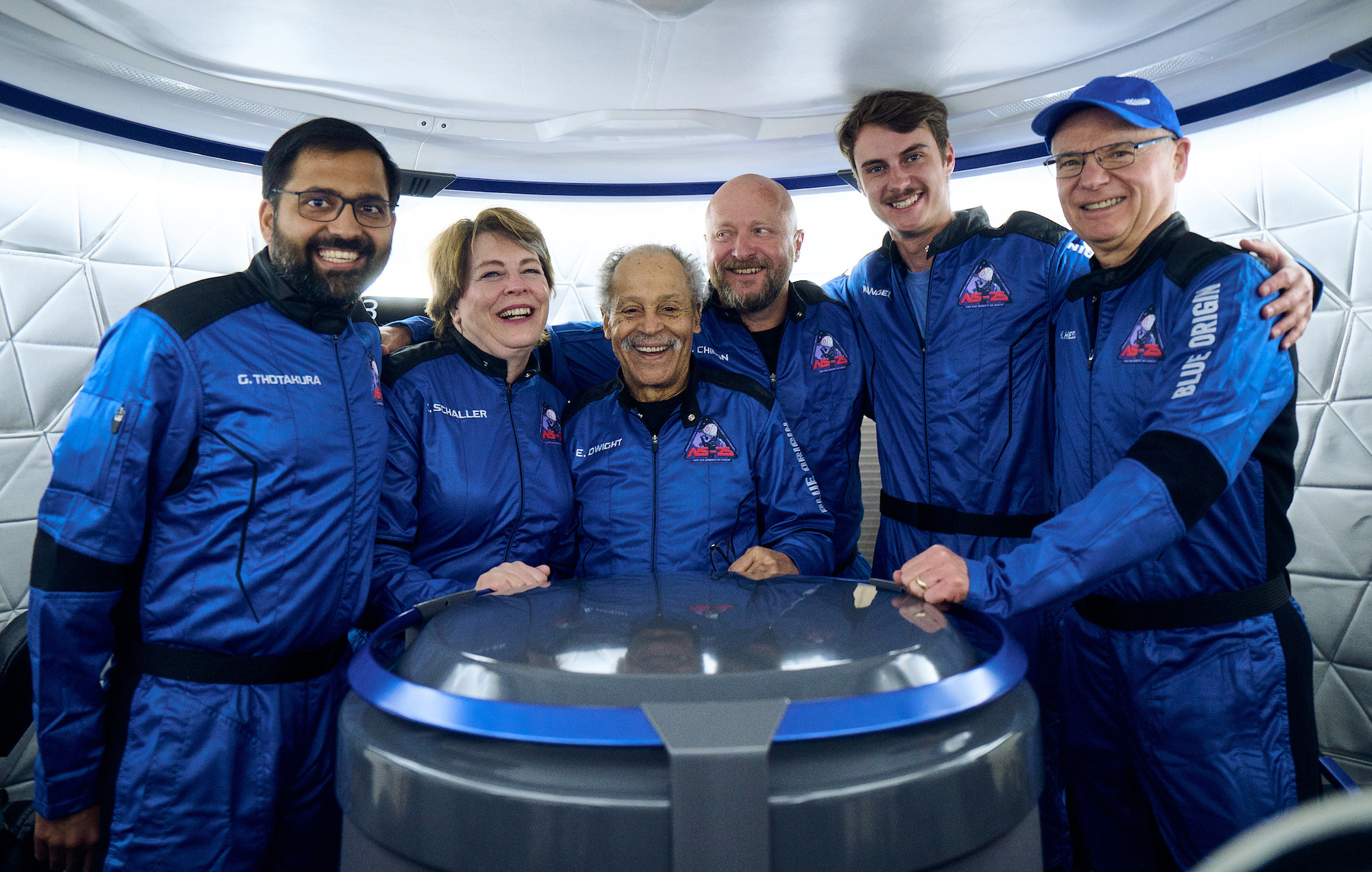 NS-25 crew: Mason Angel, Sylvain Chiron, Kenneth L. Hess, Carol Schaller, Gopi Thotakura, and former Air Force Captain Ed Dwight