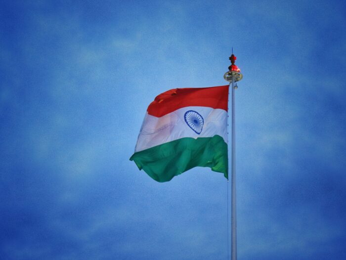 white red and green flag under blue sky during daytime